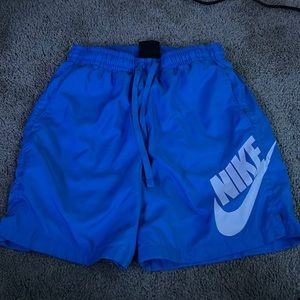 blue and white nike shorts (s)